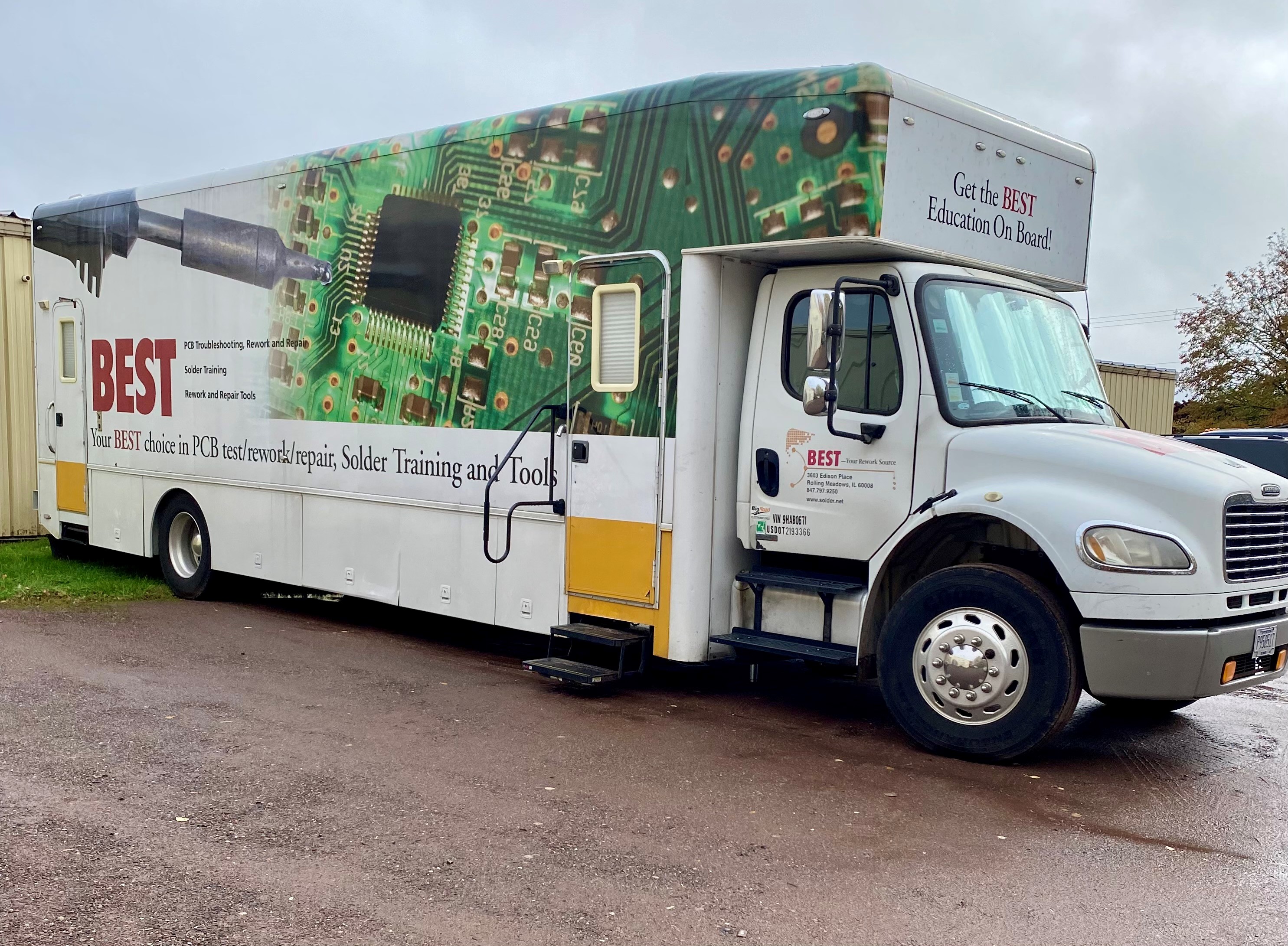 Photo of IPC Mobile Training Center, a large truck with a graphic on the side and a trailer that serves as the training center. 